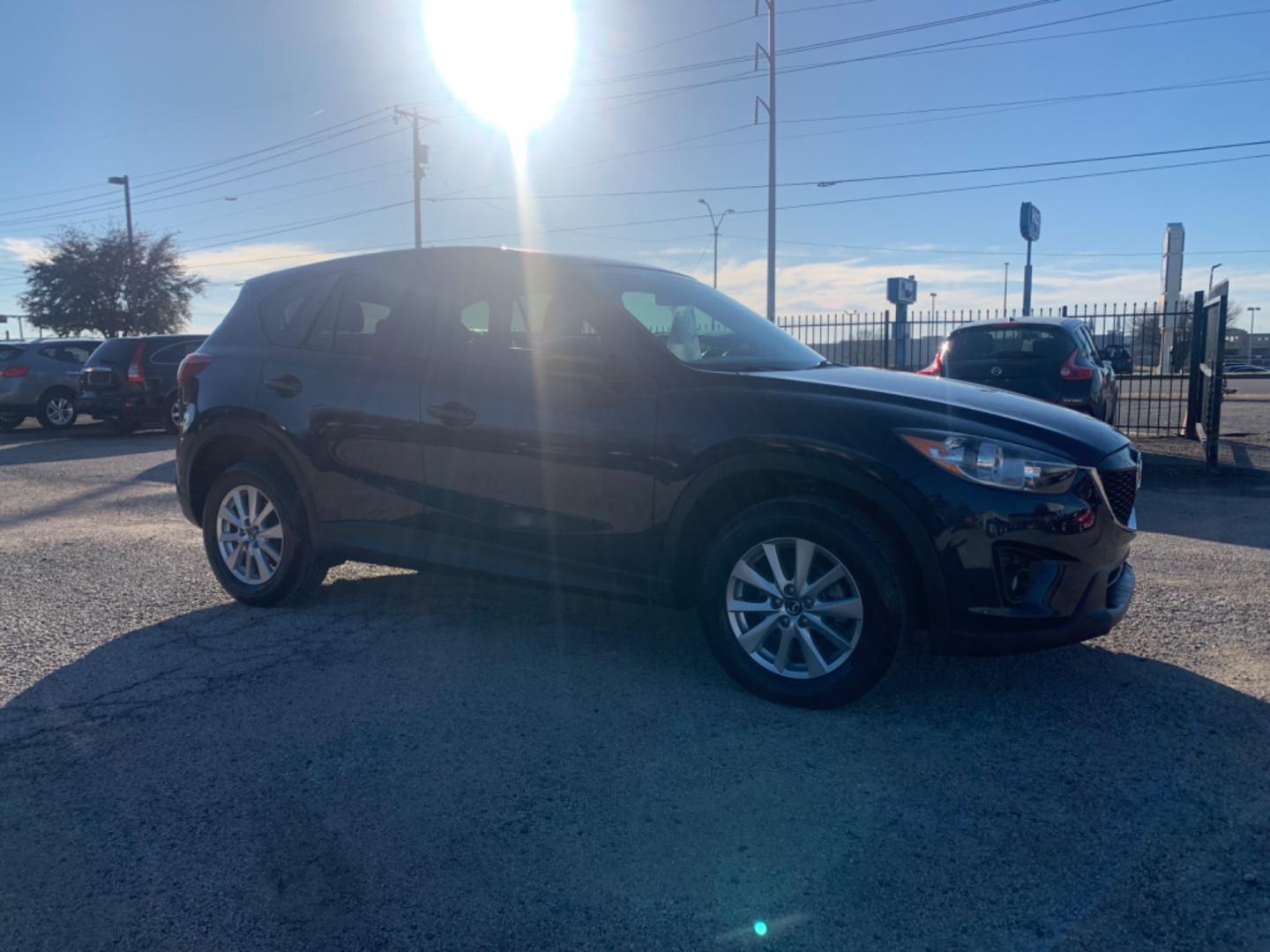 2014 Blue /Tan Mazda CX-5 Touring (JM3KE2CY1E0) with an 2.5L L4 DOHC 16V engine, Automatic transmission, located at 1830 North Belt Line Road, Irving, TX, 75061, (469) 524-0199, 32.834373, -96.993584 - Photo#5